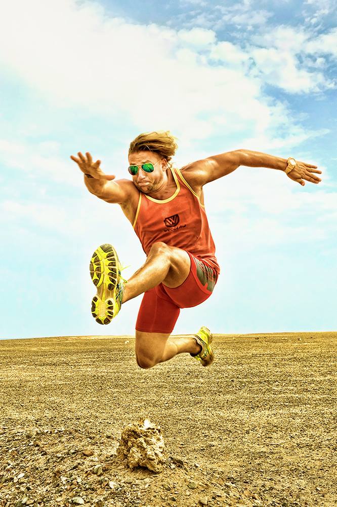 Wojtek Kosendiak in a track and field hurdle jump